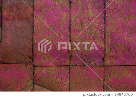 rusted tin sheets patchwork wall texture and flat background with peeling leftovers of pink paint rusted tin sheets patchwork wall texture and flat background with peeling leftovers of pink paint 84943760