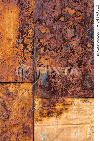 Rusted flat composite nailed metal sheets surface background and texture. Rusted flat composite nailed metal sheets surface background and texture. 84943813