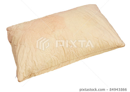 dirty used spotted pillow isolated on white background in diagonal composition 84943866