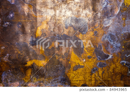 texture and background of old oxidated sheet of brass with with white patina stains and spots and some minor scratches 84943965