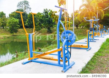 Outdoors gym playground equipment in the public garden, outdoor fitness equipment in the park 84946390