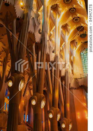 Gaudi's Masterpiece Sagrada Familia Basilica. Light through stained glass windows. Mosaic. UNESCO 84947278