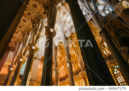 Gaudi's Masterpiece Sagrada Familia Basilica. Light through stained glass windows. Mosaic. UNESCO Gaudi's Masterpiece Sagrada Familia Basilica. Light through stained glass windows. Mosaic. UNESCO 84947279