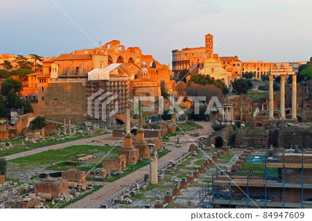 A view of the sunset over the historic forums in Rome 84947609