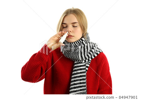 Young woman with nasal spray isolated on white background 84947901