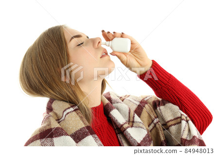 Young woman with nasal spray isolated on white background 84948013