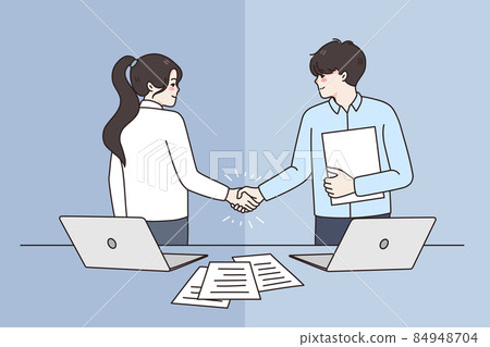 Smiling business partners handshake closing deal at meeting Smiling business partners handshake closing deal at meeting 84948704