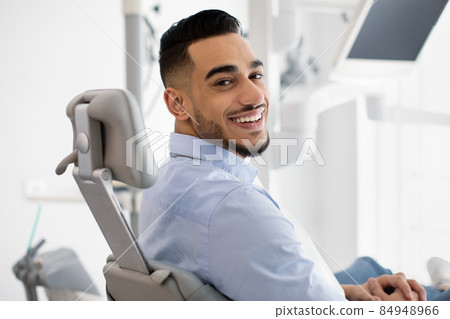 Dental Clinic Patient. Portrait Of Smiling Arab Male Posing In Dentist Chair 84948966