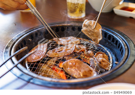 Delicious meat grilled over charcoal Delicious meat grilled over charcoal 84949069