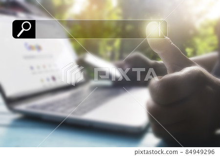 Hand man using laptop and Searching browsing data on the Internet online.network,media, keyword,Digital Web,Photo concept Searching information of and Technology. 84949296