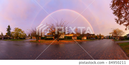 Beautiful Street view in the Residential Neighborhood during a colorful Winter. Beautiful Street view in the Residential Neighborhood during a colorful Winter. 84950211