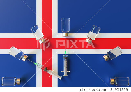 Glass vials and syringes on the flag of Iceland. Vaccination related conceptual 3D rendering Glass vials and syringes on the flag of Iceland. Vaccination related conceptual 3D rendering 84951299