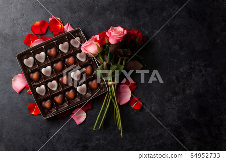 Rose flowers and heart chocolate Rose flowers and heart chocolate 84952733