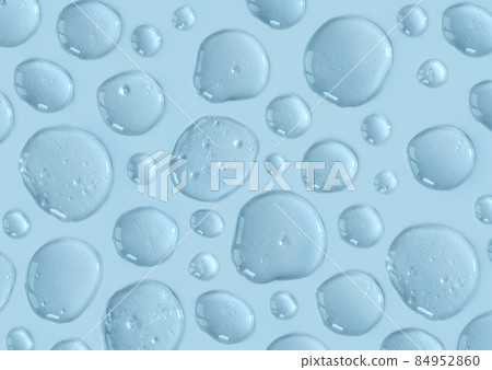 Blue doses of acid, hyaluronic moisturizing serum or gel on a monochrome background. Abstract backdrop pattern. Beauty product wallpaper. Cosmetics or healthcare protection concept.  84952860