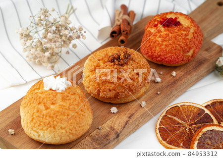 Homemade three shu cake with vanilla custard inside 84953312