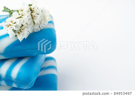 Bars of handmade natural soap and flowers on white background 84953497