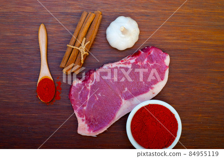 raw uncooked  ribeye beef steak butcher selection 84955119