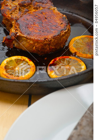 pork chop seared on iron skillet 84956057