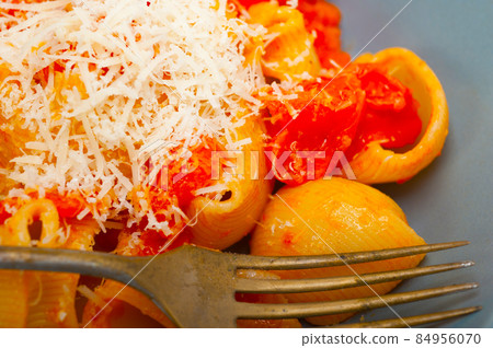 Italian snail lumaconi pasta with tomatoes Italian snail lumaconi pasta with tomatoes 84956070