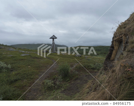Bell towe and church at traditonal saami style at Staloluokta sami village at Virihaure lake. Summer moody and foggy day at Padjelantaleden hiking trail. Sweden Lapland 84956175