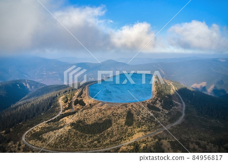 Pumped water storage hydroelectric plant reservoir aerial view Pumped water storage hydroelectric plant reservoir aerial view 84956817