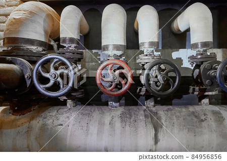 Industrial valve in an old factory Industrial valve in an old factory 84956856
