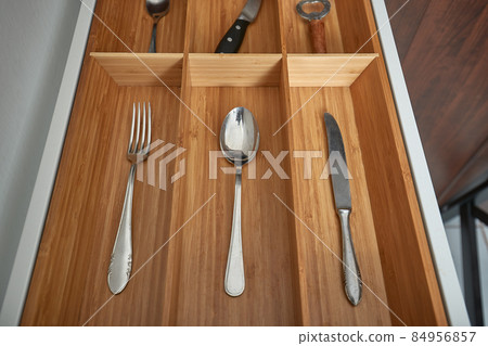 Minimalist kitchen tools put away in a drawer Minimalist kitchen tools put away in a drawer 84956857