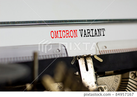 Covid-19 new omicron virus variant symbol. Concept words Omicron variant typed on retro typewriter. Medical and COVID-19 pandemic new omicron variant strain mutation concept. 84957167