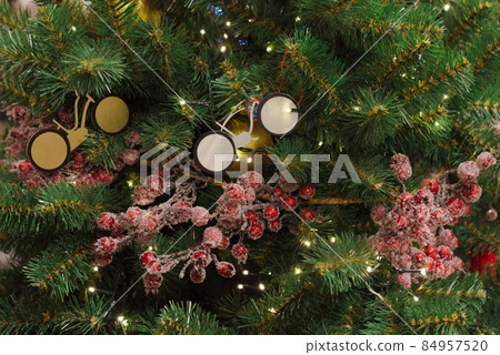 The Christmas tree is decorated with toy bicycles. Dream concept, bike as a gift. Extraordinary design. Style. 84957520