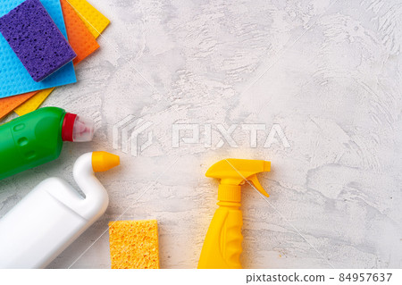 Home cleaning supplies on white wooden background, top view Home cleaning supplies on white wooden background, top view 84957637