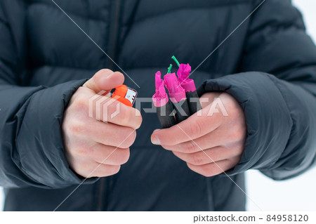 Guy Sets Fire to the Flash Noise Firecrackers Outdoors 84958120