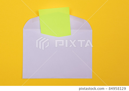 Violet Envelope with Blank Green Sheet of Paper Inside Violet Envelope with Blank Green Sheet of Paper Inside 84958129