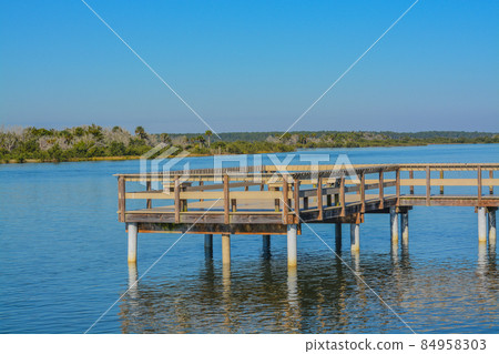 A Fishing Pier on the Intracoastal Waterway at Bings landing, Flagler County, Florida A Fishing Pier on the Intracoastal Waterway at Bings landing, Flagler County, Florida 84958303