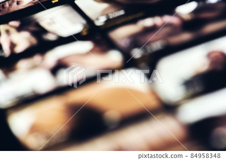 Watching porn on mobile phone, blurred image of mobile phone with porn scenes. Watching porn adult TV channel Watching porn on mobile phone, blurred image of mobile phone with porn scenes. Watching porn adult TV channel 84958348