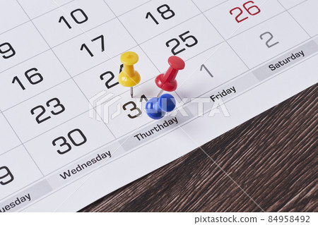 Last chance concept with colored push pins on monthly calendar. Last day of month highlighted on calendar. Monthly calendar. Last chance or deadline concept Last chance concept with colored push pins on monthly calendar. Last day of month highlighted on calendar. Monthly calendar. Last chance or deadline concept 84958492