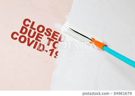 Shopkeeper painting walls renovating after closing due to COVID-19. 84961679