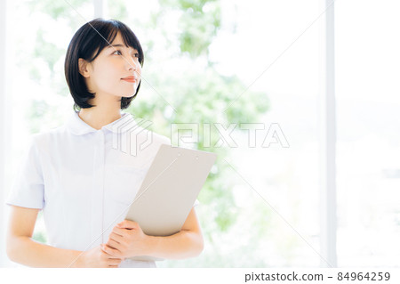 Smiling female nurse Smiling female nurse 84964259