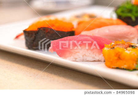 Focus on fresh Tuna Sushi or Maguro Sushi on white plate, mix Sushi together in one plate, close up image, selected focus. Focus on fresh Tuna Sushi or Maguro Sushi on white plate, mix Sushi together in one plate, close up image, selected focus. 84965098