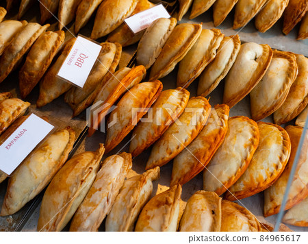 Baked snack empanada at market Baked snack empanada at market 84965617