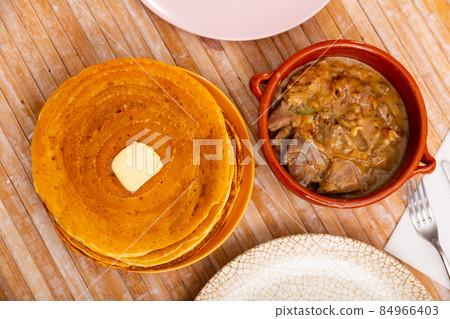 Pancakes with meat and vegetables stew machanka 84966403