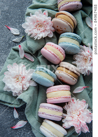 Beautiful colorful tasty macaroons on a concrete background Beautiful colorful tasty macaroons on a concrete background 84967488