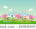 People relaxing in the cherry blossom spring park 84968400