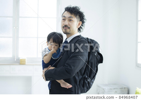 Daddy in a suit to pick you up at the nursery school 84968407