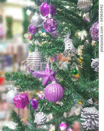 Christmas tree decorated with beautiful ornaments 84968442