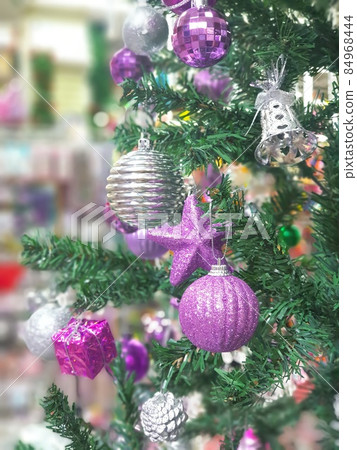 Christmas tree decorated with beautiful ornaments 84968444
