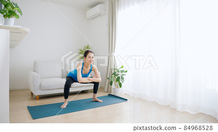 Senior women stretching at home (health / healthcare) 84968528