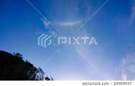 Upside-down rainbow, Circumzenithal arc seen on a sunny day in spring 84969047