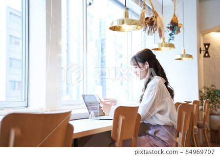 A young woman working A young woman working 84969707