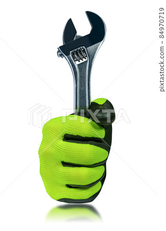 Hand with Protective Work Glove Holding a Steel Adjustable Wrench 84970719