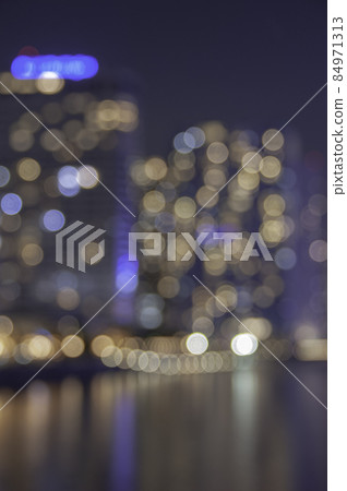 The waterside apartment at night can be seen in the background The waterside apartment at night can be seen in the background 84971313